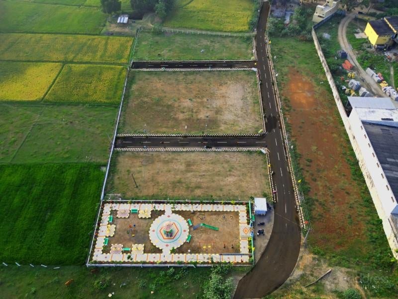 Farmhouse plot with surrounding green fields